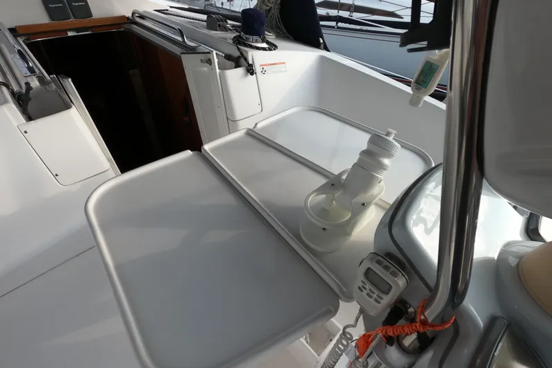 Slide: The Image of Cockpit of 2013 Marlow-Hunter e33 sailboat with table and equipment. - 16
