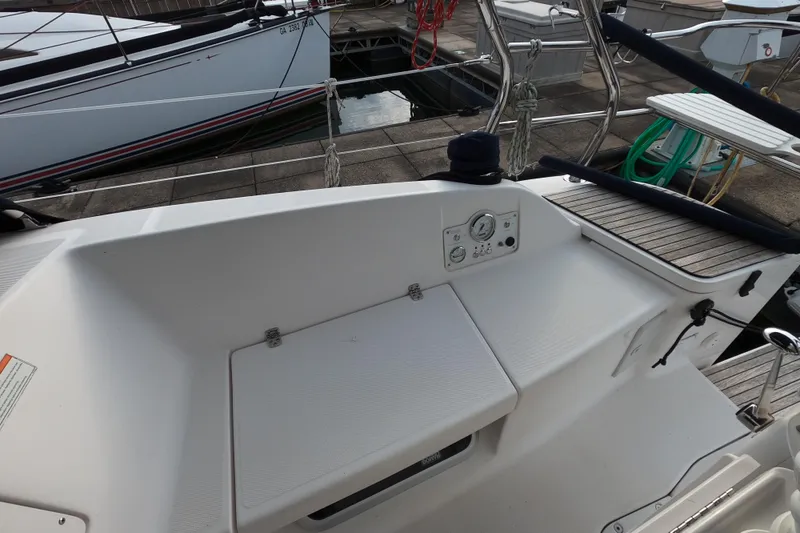 Slide: The Image of 2013 Marlow-Hunter e33 sailboat cockpit with control panel and seating area. - 18