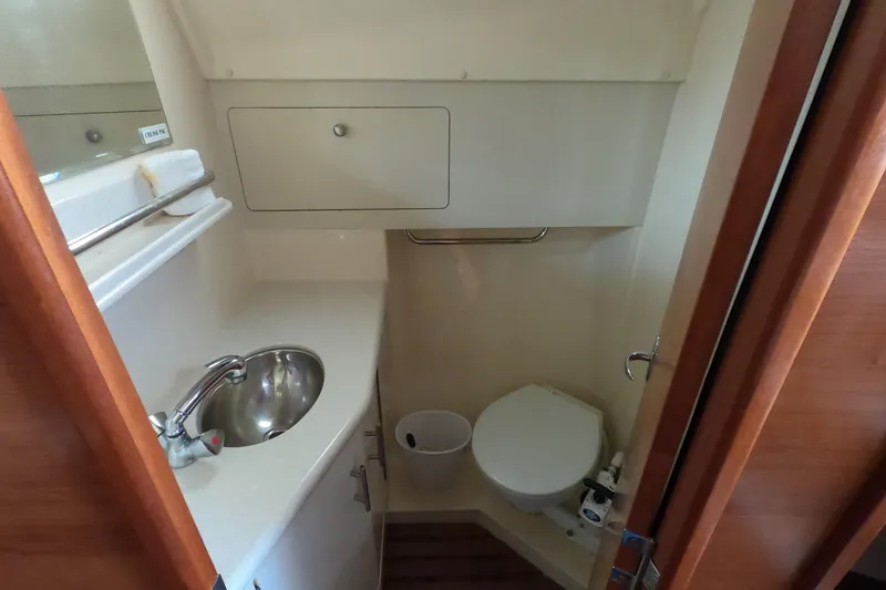 Slide: The Image of Compact bathroom in 2013 Marlow-Hunter e33 sailboat with sink and toilet. - 22