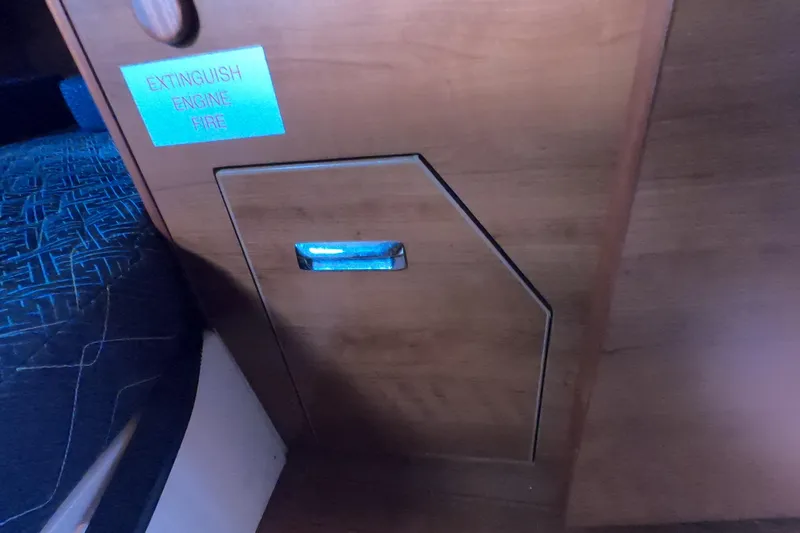 Slide: The Image of 2013 Marlow-Hunter e33 interior with engine fire extinguisher access panel. - 26