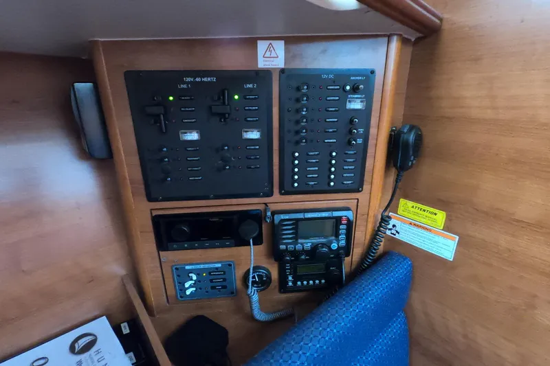 Slide: The Image of Control panel of a 2013 Marlow-Hunter e33 sailboat with communication equipment. - 39