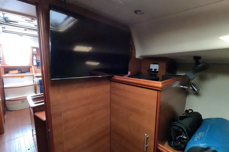 Slide: The Image of Interior of 2013 Marlow-Hunter e33 sailboat with TV and wooden cabinetry. - 41