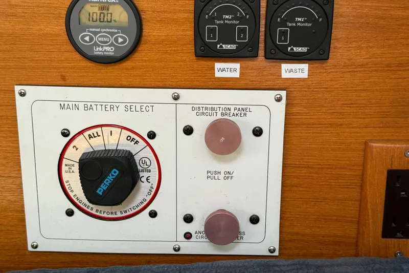 Slide: The Image of Control panel of a 2000 Catalina 320 sailboat with battery and tank monitors. - 16
