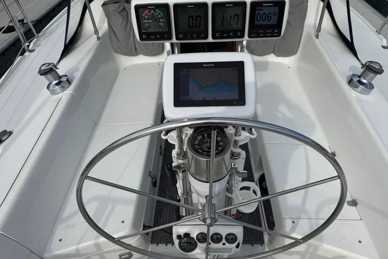 Slide: The Image of Steering wheel and navigation instruments on a 2000 Catalina 320 sailboat cockpit. - 6