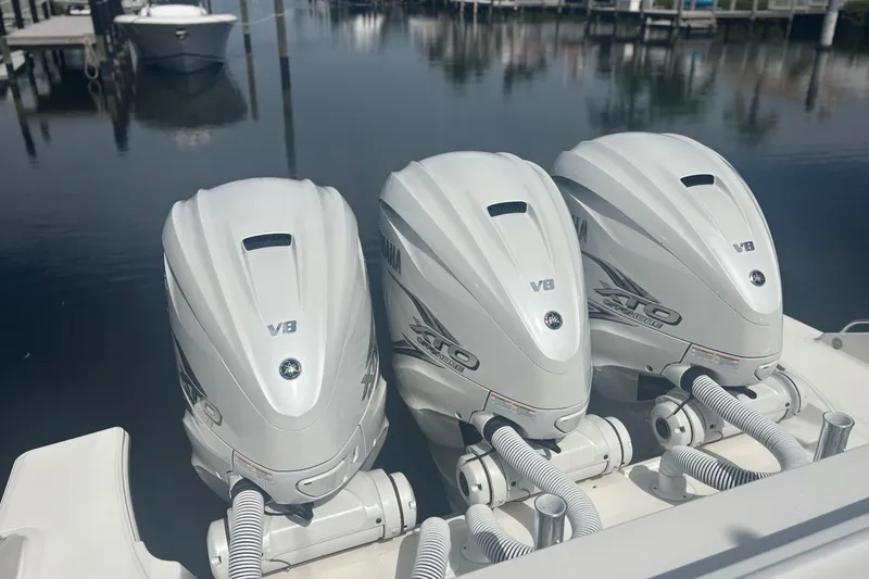Slide: The Image of Triple Yamaha V8 outboard engines on a 2021 Pursuit S 378 Sport boat. - 15