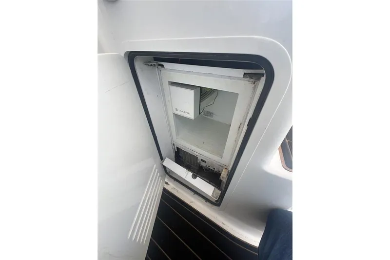 Slide: The Image of Open refrigerator on 2007 Sea Ray 52 Sedan Bridge yacht. - 11