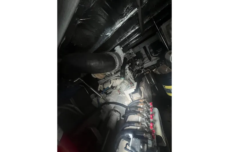 Slide: The Image of Engine room of a 2007 Sea Ray 52 Sedan Bridge yacht, showcasing mechanical components. - 16