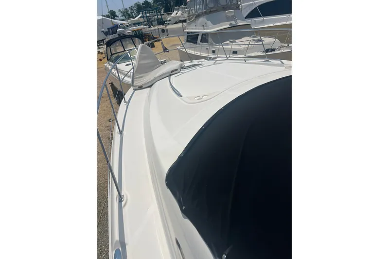 Slide: The Image of 2007 Sea Ray 52 Sedan Bridge yacht docked at marina, showcasing sleek design. - 19