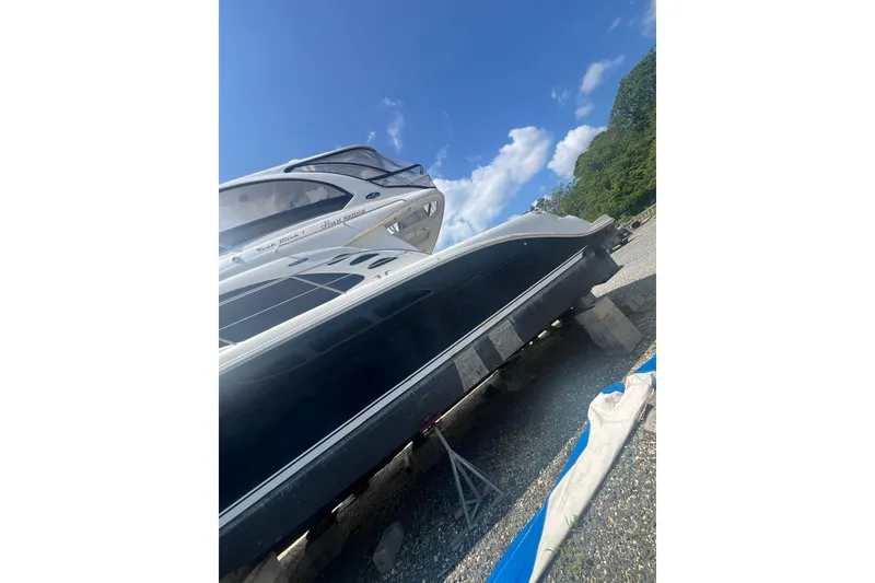 Slide: The Image of 2007 Sea Ray 52 Sedan Bridge yacht on dry dock under a clear blue sky. - 20