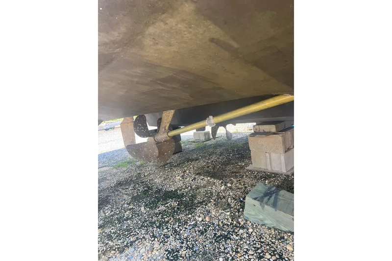Slide: The Image of Underneath view of a 2007 Sea Ray 52 Sedan Bridge boat on blocks. - 25