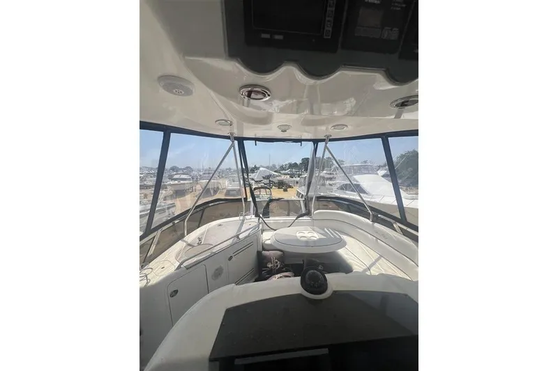 Slide: The Image of Interior view of 2007 Sea Ray 52 Sedan Bridge yacht cockpit. - 4