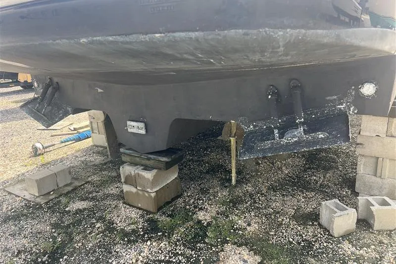 Slide: The Image of 2007 Sea Ray 52 Sedan Bridge boat hull on blocks, showing underside details. - 5