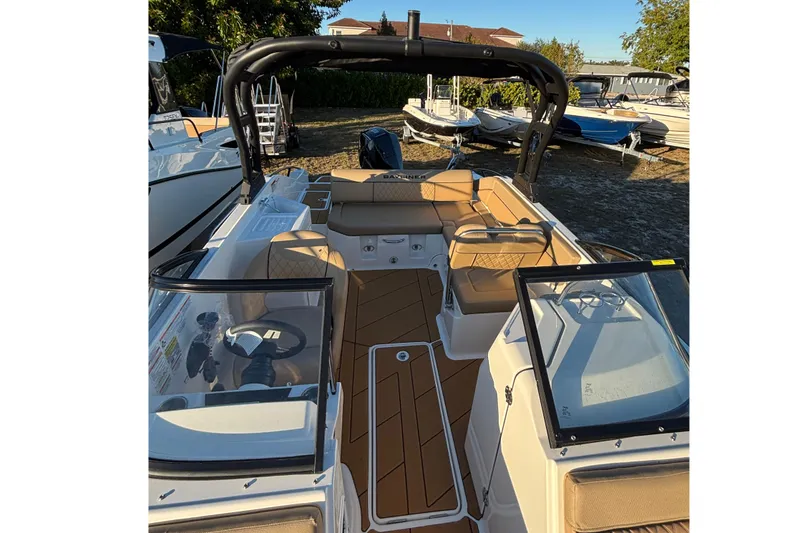Slide: The Image of 2026 Bayliner D22 boat interior with tan seating and sleek design. - 18