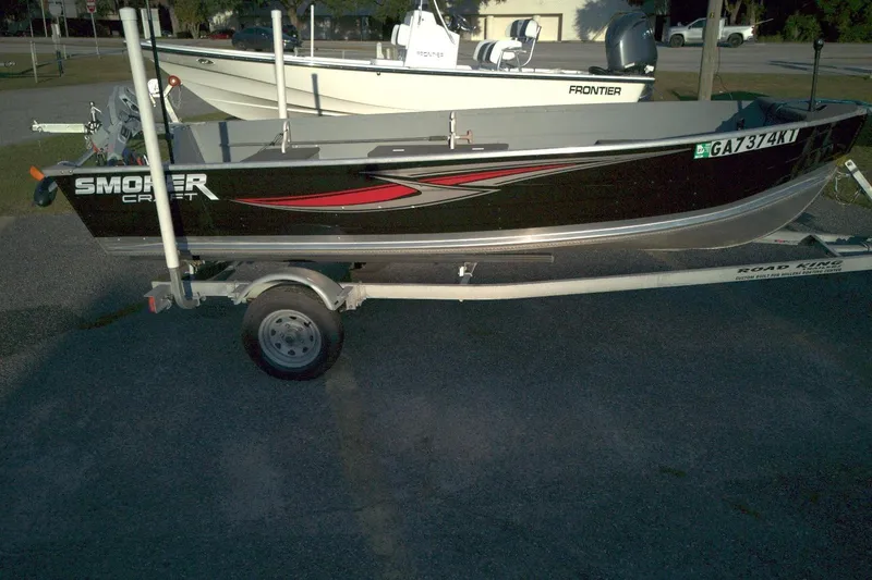 Slide: The Image of 2021 Smoker Craft 14 Big Fish boat on trailer, parked outdoors. - 3