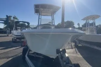 Slide: The Image of 2023 Key West 203 FS boat on trailer under clear blue sky. - 3