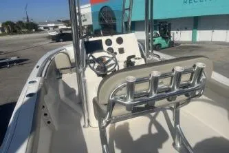 Slide: The Image of 2023 Key West 203 FS boat interior with steering console and rod holders. - 7