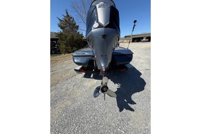 Slide: The Image of 2023 Skeeter ZXR21 boat rear view with powerful outboard motor and propeller. - 3