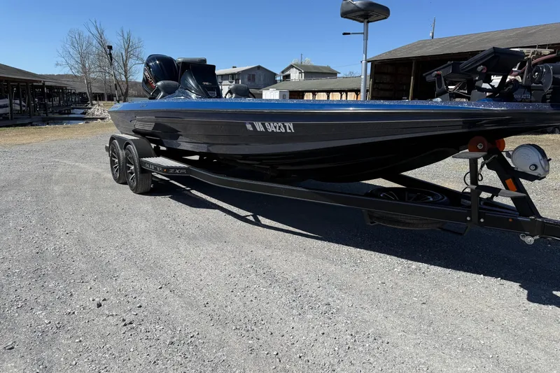 Slide: The Image of 2023 Skeeter ZXR21 boat on trailer in outdoor setting. - 7