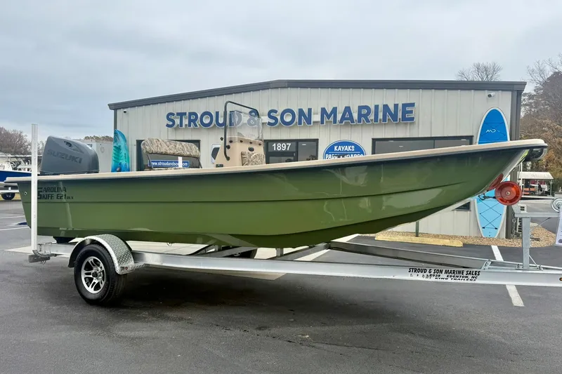 The Image of 2026 Carolina Skiff E21 DLX CC boat on trailer at Stroud & Son Marine. - 1