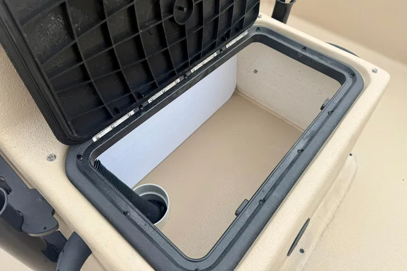 Slide: The Image of Open storage compartment on 2026 Carolina Skiff E21 DLX CC boat. - 16