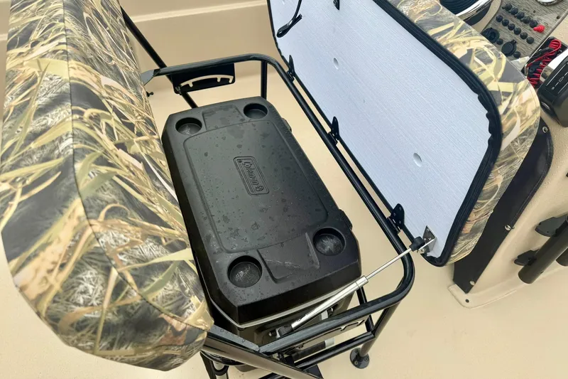 Slide: The Image of Camouflage seat with storage compartment on 2026 Carolina Skiff E21 DLX CC boat. - 20