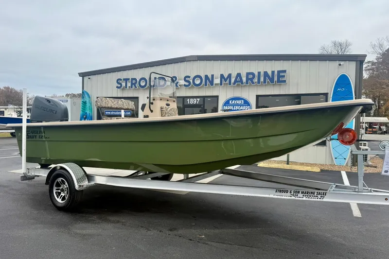 Slide: The Image of 2026 Carolina Skiff E21 DLX CC boat on trailer at Stroud & Son Marine. - 6