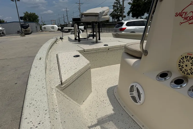 Slide: The Image of 2015 Xpress H20 boat interior with seating and storage compartments. - 15