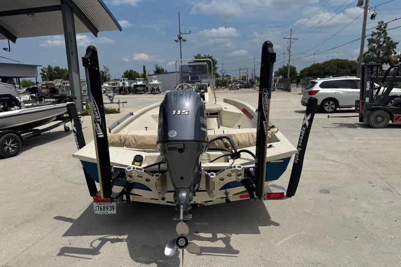 Slide: The Image of 2015 Xpress H20 boat with Yamaha 115 engine in a parking lot. - 4