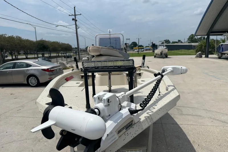 Slide: The Image of 2015 Xpress H20 boat with trolling motor in a parking lot. - 8