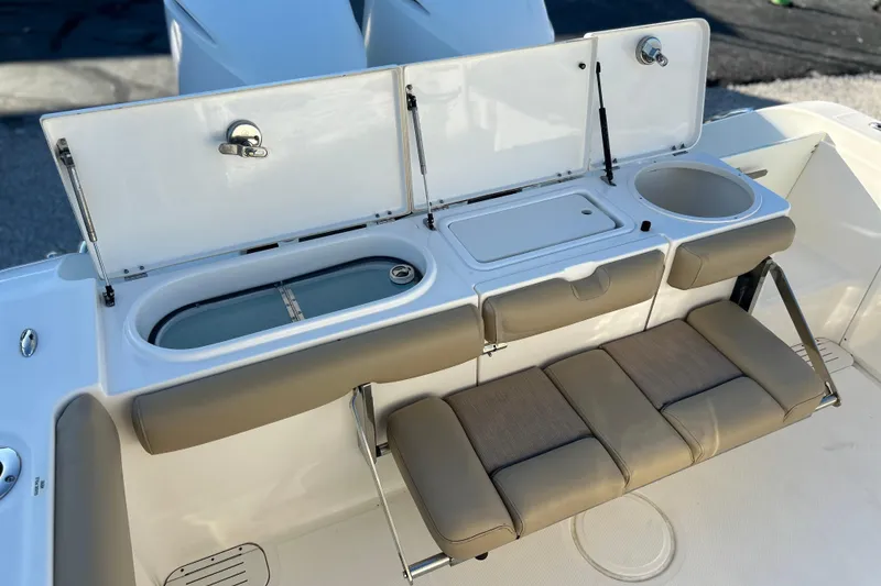 Slide: The Image of 2017 Key West Billistic 281 Center Console boat interior with seating and storage compartments. - 10