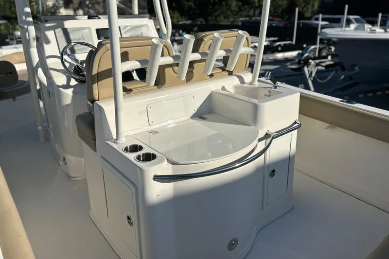 Slide: The Image of 2017 Key West Billistic 281 Center Console boat interior with seating and sink. - 15
