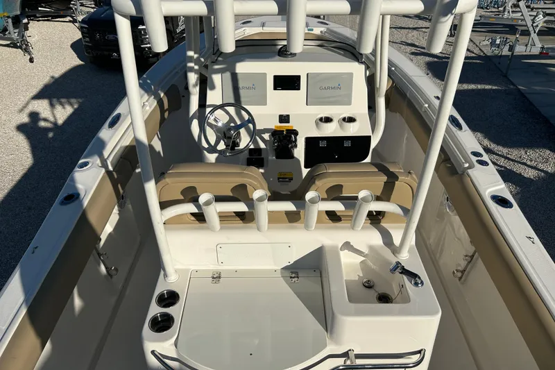 Slide: The Image of 2017 Key West Billistic 281 Center Console boat interior with steering wheel and controls. - 17