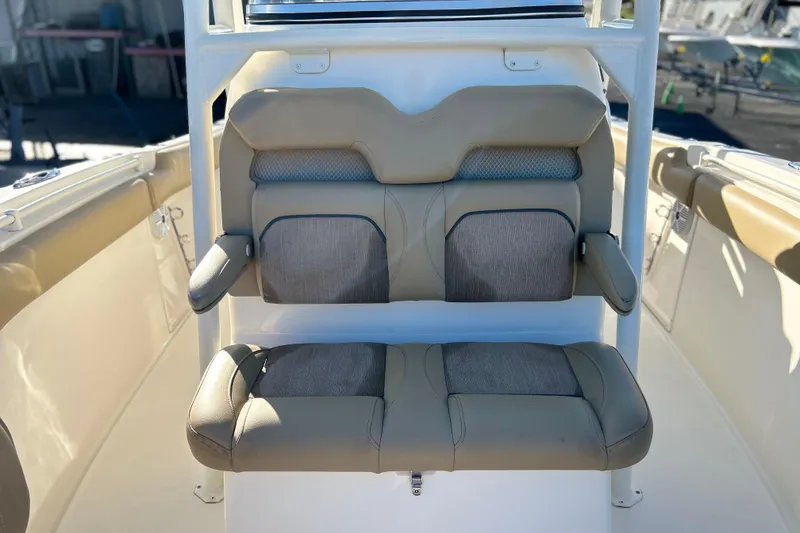Slide: The Image of 2017 Key West Billistic 281 Center Console boat seating, featuring cushioned dual seats. - 22