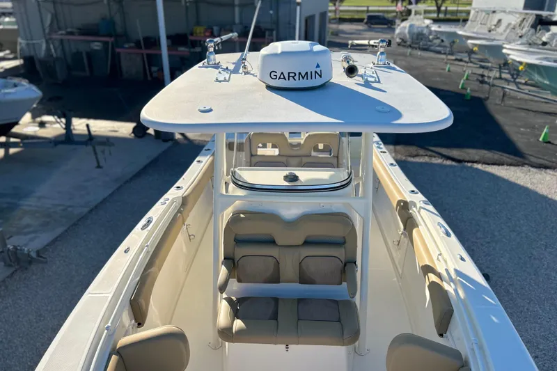 Slide: The Image of 2017 Key West Billistic 281 Center Console boat with Garmin equipment, docked at a marina. - 23