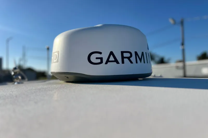 Slide: The Image of Garmin radar on 2017 Key West Billistic 281 Center Console boat under clear blue sky. - 24