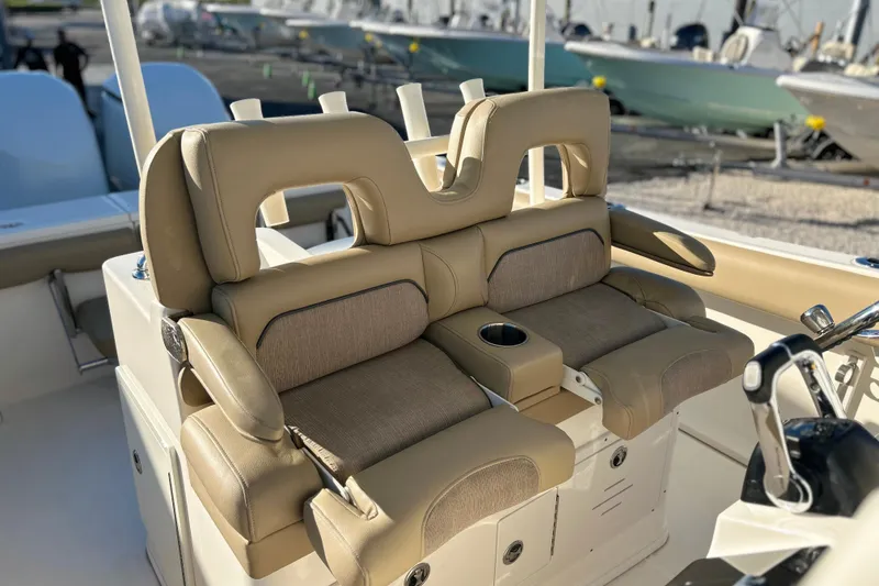 Slide: The Image of 2017 Key West Billistic 281 Center Console boat with beige cushioned seating. - 25