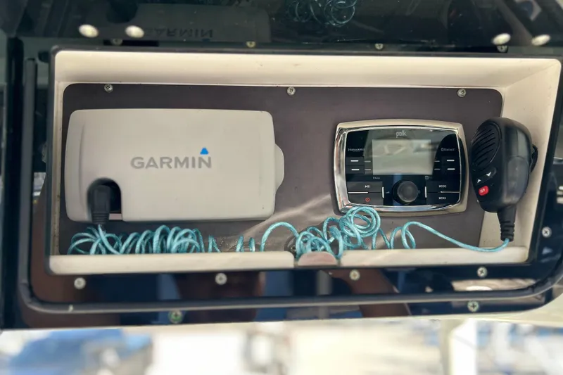 Slide: The Image of 2017 Key West Billistic 281 Center Console dashboard with Garmin and Polk audio equipment. - 33