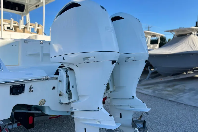 Slide: The Image of 2017 Key West Billistic 281 Center Console with dual outboard engines. - 35