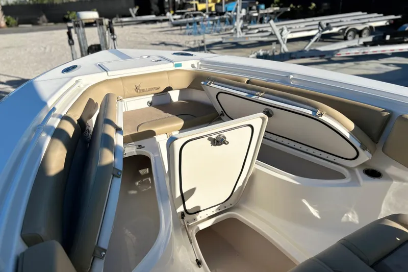 Slide: The Image of 2017 Key West Billistic 281 Center Console boat interior with open storage compartments. - 5