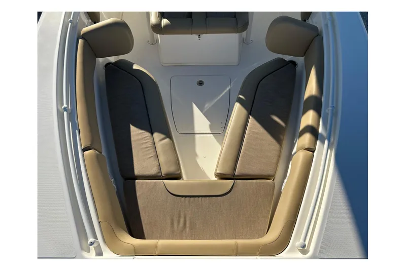 Slide: The Image of 2017 Key West Billistic 281 Center Console boat seating area with cushioned seats. - 6