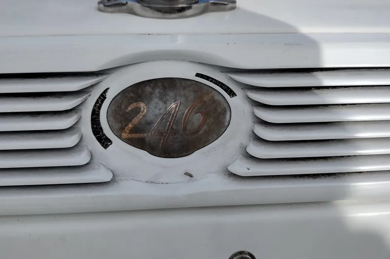 Slide: The Image of Close-up of a 2000 Cobalt 246 emblem on a white surface. - 8