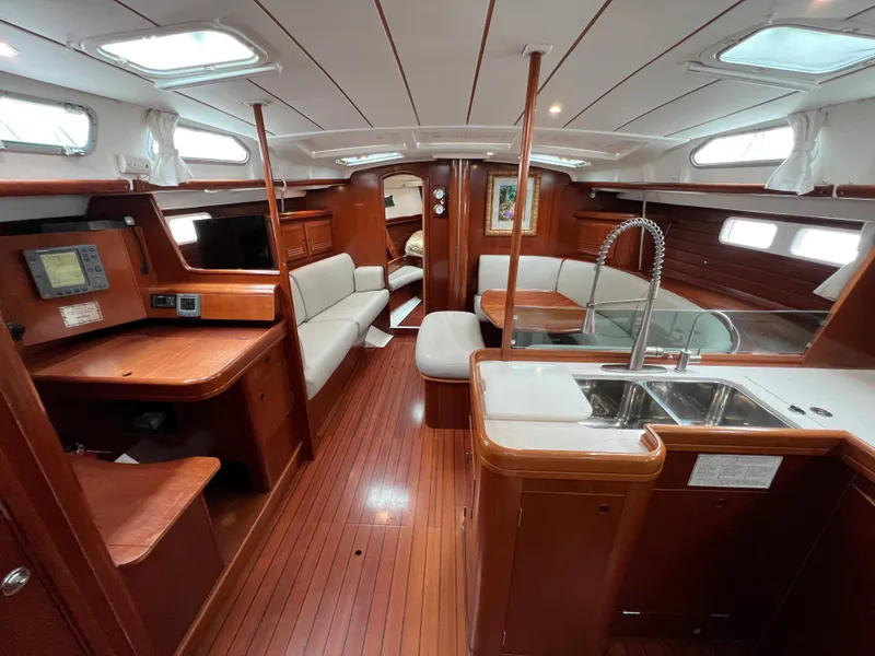 Slide: The Image of Interior of 2004 Beneteau 473 yacht with wood finish and modern amenities. - 31