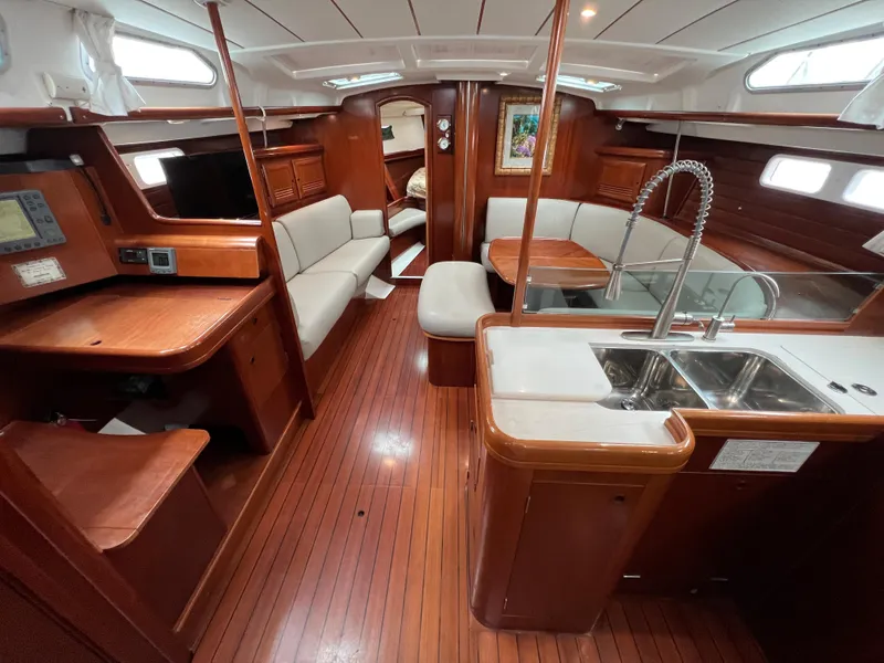 Slide: The Image of Luxurious interior of a 2004 Beneteau 473 yacht with wood finish and modern amenities. - 33