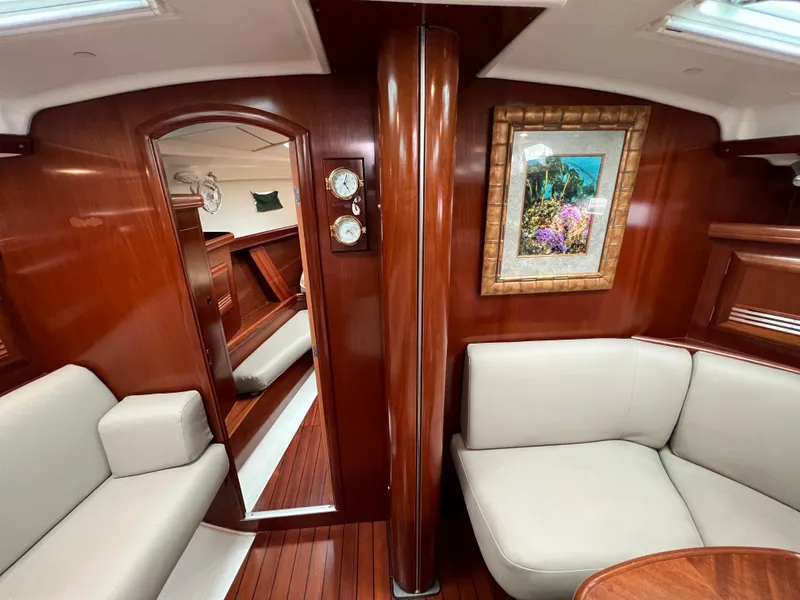 Slide: The Image of Luxurious interior of 2004 Beneteau 473 yacht with elegant wood finish and comfortable seating. - 39