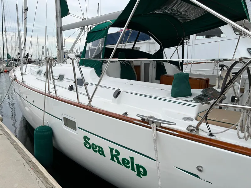 Slide: The Image of 2004 Beneteau 473 sailboat named "Sea Kelp" docked at a marina. - 5