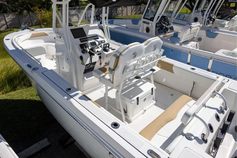 Slide: The Image of 2023 Edgewater 245CC boat interior with modern console and seating. - 4