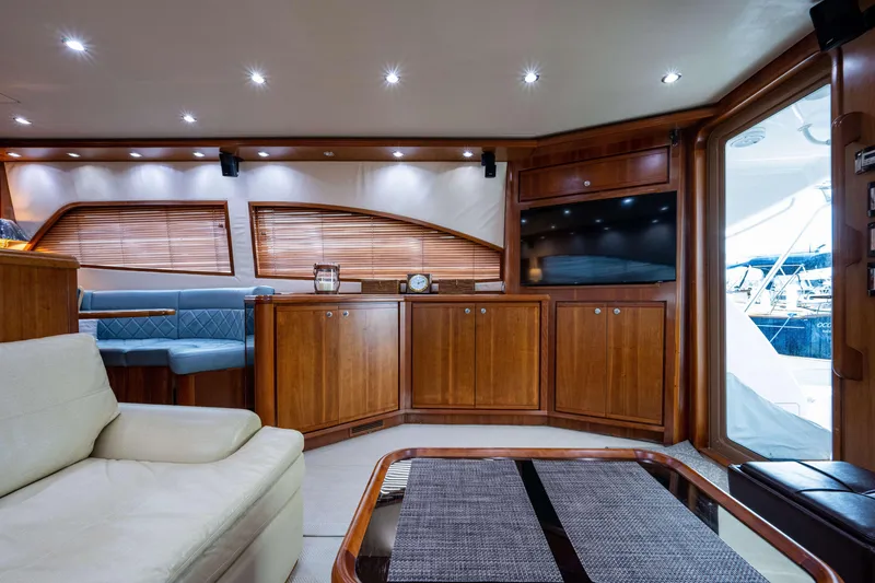 Slide: The Image of Luxurious interior of 2008 Bertram 570 yacht with wooden cabinetry and modern furnishings. - 30