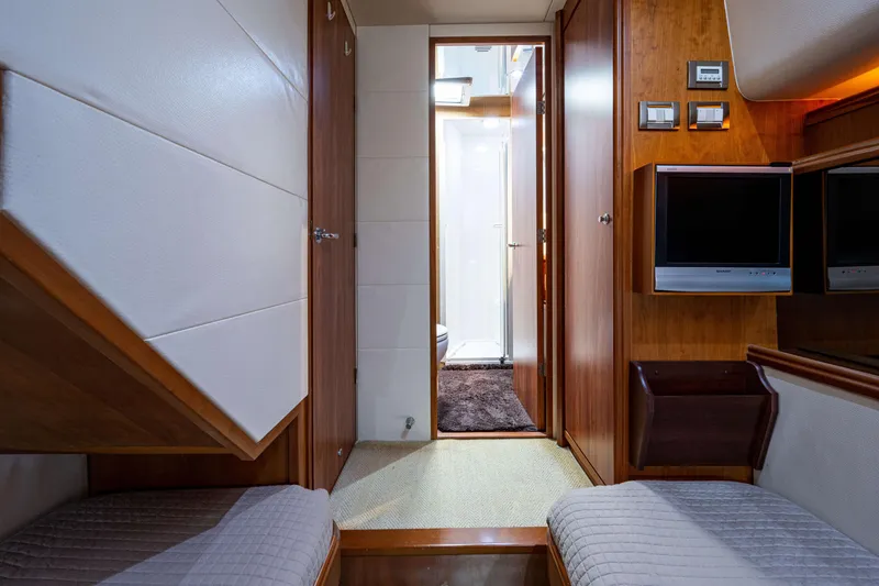 Slide: The Image of Interior of 2008 Bertram 570 yacht with wood paneling and modern amenities. - 48