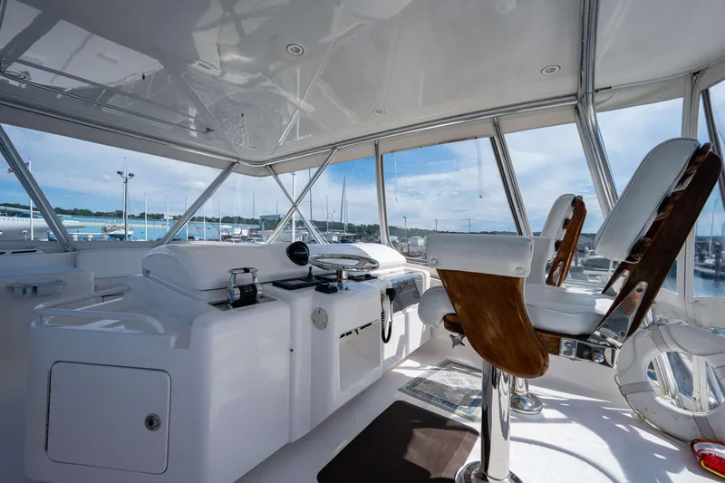 Slide: The Image of Interior view of 2008 Bertram 570 yacht cockpit with steering and seating. - 20