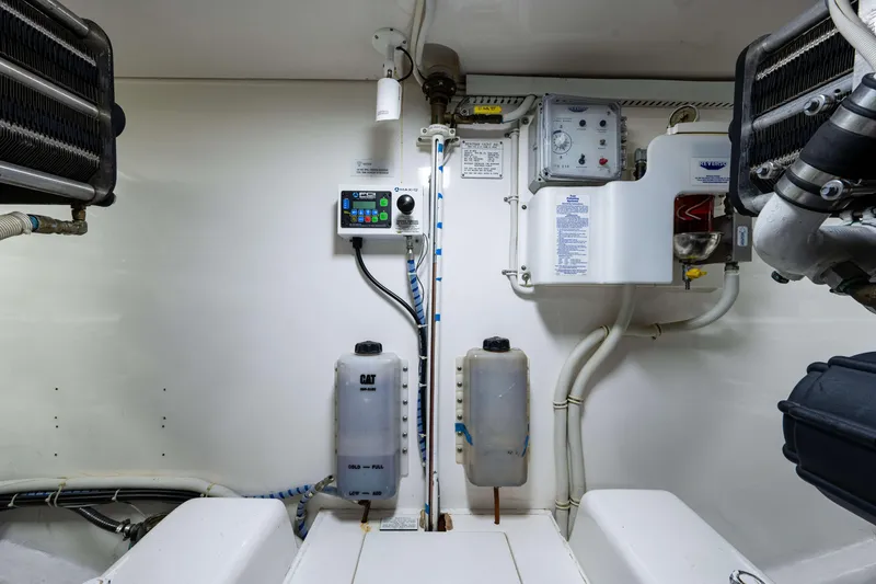 Slide: The Image of Engine room of 2008 Bertram 570 yacht with control panels and equipment. - 60